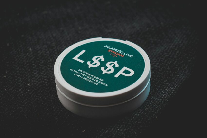 a white container with a green label on it